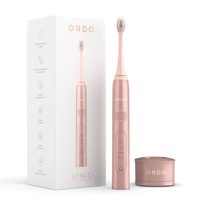 Ordo Rose Gold Sonic+ Toothbrush with packaging and Sonic+ Charging Base